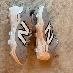 New Balance Women’s Gray and White Cleats NEVER WORN